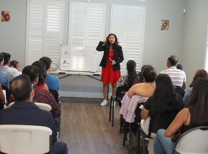 Author speaking at the Book Shower